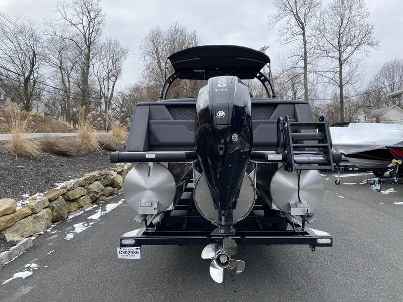 Slide: The Image of 2025 Viaggio D24U boat with powerful outboard motor, parked on a paved area. - 6