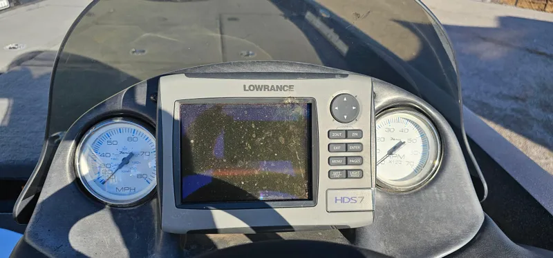 Slide: The Image of Dashboard of a 2009 Stratos 201 XL boat with Lowrance HDS-7 display. - 12