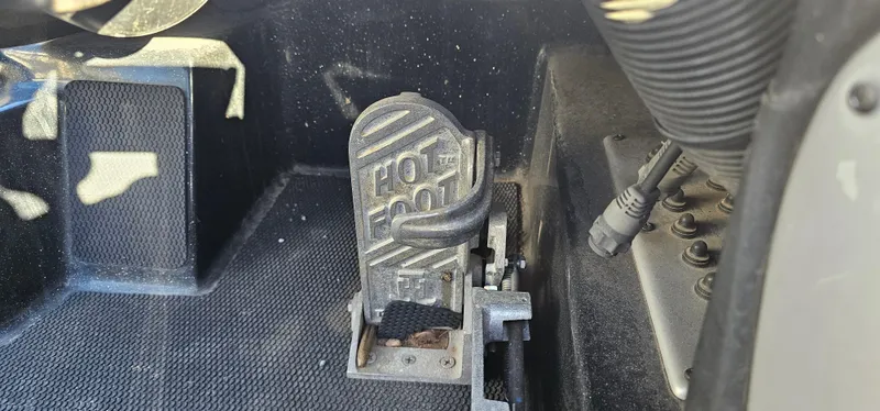 Slide: The Image of Close-up of a 2009 Stratos 201 XL boat foot pedal control. - 16