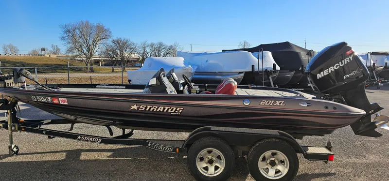 Slide: The Image of 2009 Stratos 201 XL boat on trailer with Mercury outboard motor. - 2