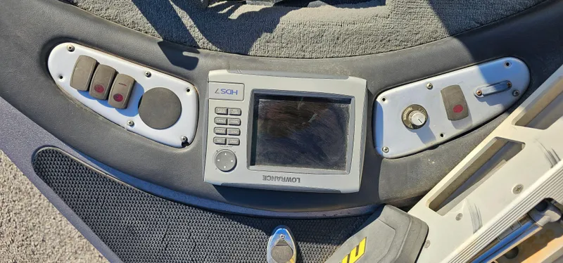 Slide: The Image of Control panel of a 2009 Stratos 201 XL boat with navigation system. - 7