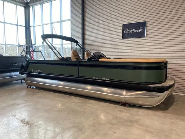 The Image of 2025 Viaggio X22S pontoon boat in showroom, featuring sleek design and modern amenities. - 1