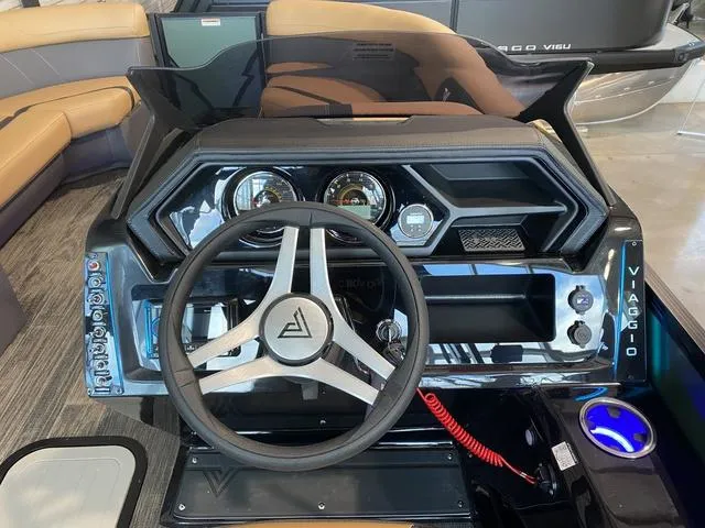 Slide: The Image of Dashboard of 2025 Viaggio X22S boat with modern steering wheel and controls. - 9