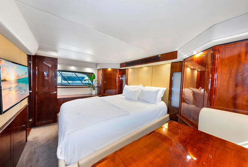 Slide: The Image of Luxurious bedroom interior of 2009 Sea Ray 55 Sundancer yacht with elegant wood finishes. - 12