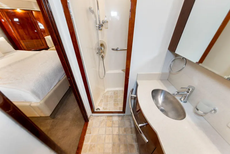 Slide: The Image of Luxurious bathroom in 2009 Sea Ray 55 Sundancer yacht with shower and sink. - 14
