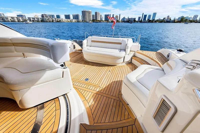 Slide: The Image of Luxurious 2009 Sea Ray 55 Sundancer yacht deck with city skyline view. - 19