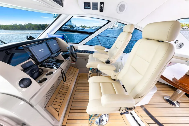 Slide: The Image of Luxurious 2009 Sea Ray 55 Sundancer helm with leather seats and advanced navigation systems. - 24
