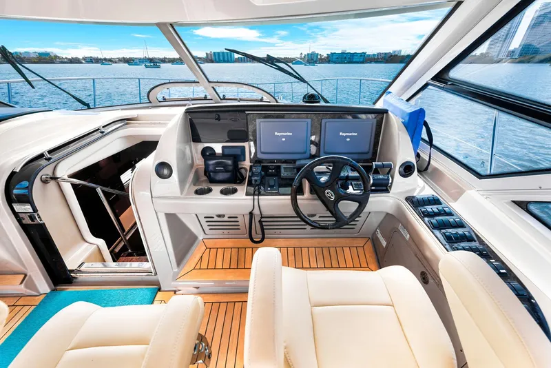 Slide: The Image of Interior helm of 2009 Sea Ray 55 Sundancer yacht with dual Raymarine displays. - 25