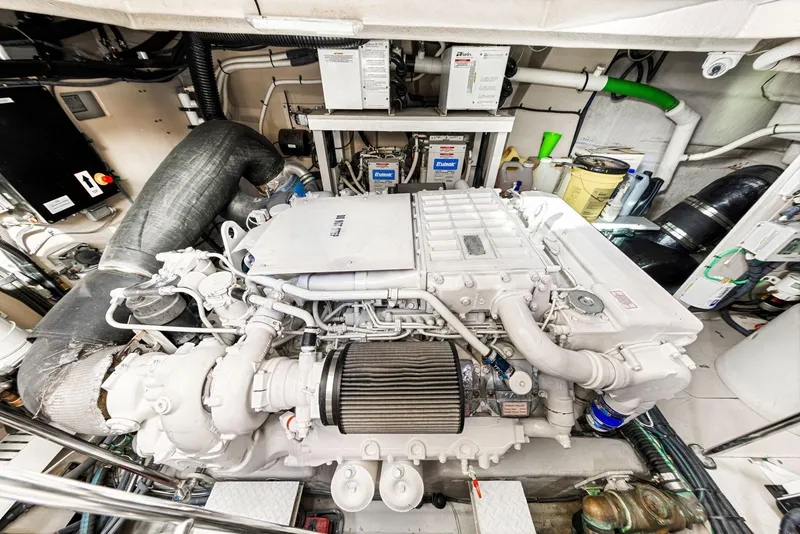 Slide: The Image of Engine room of 2009 Sea Ray 55 Sundancer yacht, showcasing detailed machinery and components. - 30