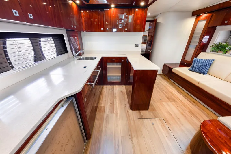 Slide: The Image of Luxurious interior of 2009 Sea Ray 55 Sundancer yacht with modern kitchen and seating area. - 8