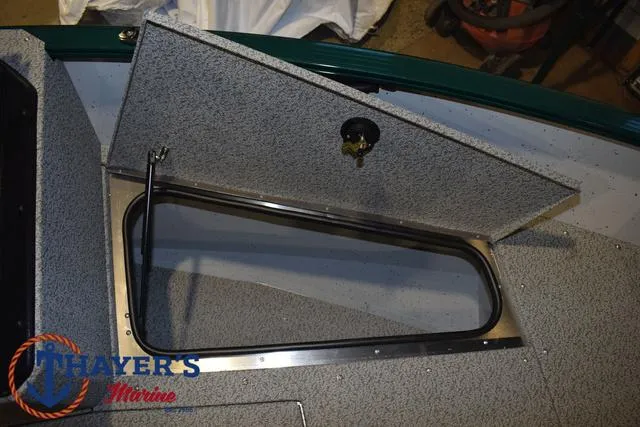 Slide: The Image of Open storage compartment on 2025 Lund 1675 Adventure Sport boat deck. - 12