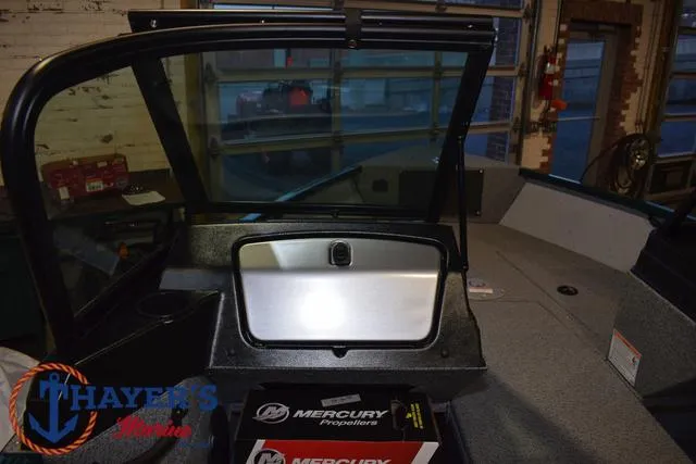 Slide: The Image of 2025 Lund 1675 Adventure Sport boat interior with Mercury Propellers box. - 20