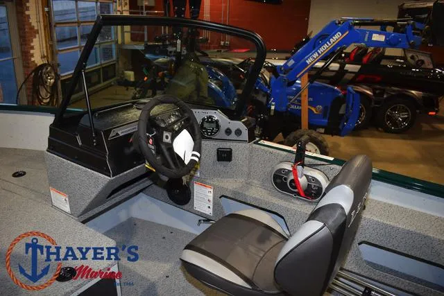 Slide: The Image of 2025 Lund 1675 Adventure Sport boat interior at Thayer's Marine showroom. - 22