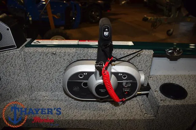 Slide: The Image of Control panel of 2025 Lund 1675 Adventure Sport boat with throttle and safety lanyard. - 24