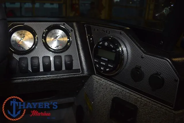 Slide: The Image of Dashboard of 2025 Lund 1675 Adventure Sport boat with gauges and controls. - 25