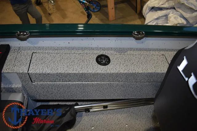 Slide: The Image of 2025 Lund 1675 Adventure Sport boat interior with storage compartment and seating. - 29