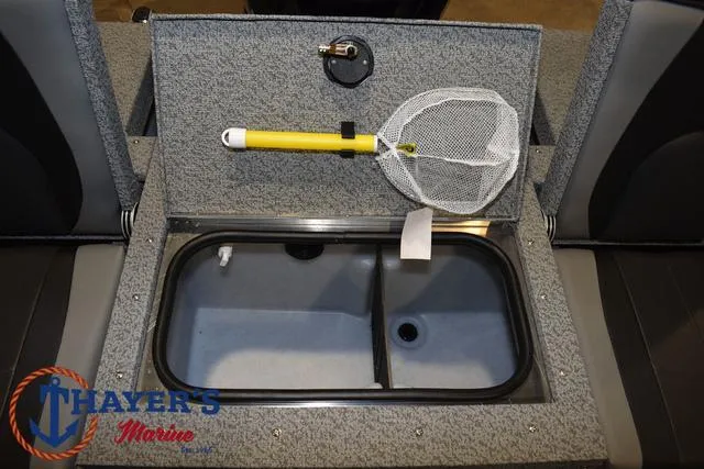 Slide: The Image of 2025 Lund 1675 Adventure Sport boat livewell with fishing net, Thayer's Marine logo. - 32