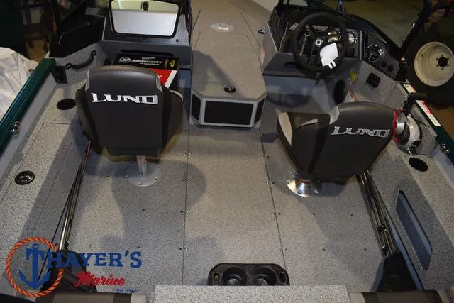 Slide: The Image of 2025 Lund 1675 Adventure Sport boat interior with dual seats and steering console. - 37