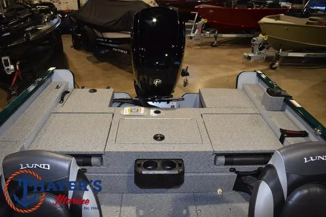 Slide: The Image of 2025 Lund 1675 Adventure Sport boat interior with motor, showcased at Thayer's Marine. - 40