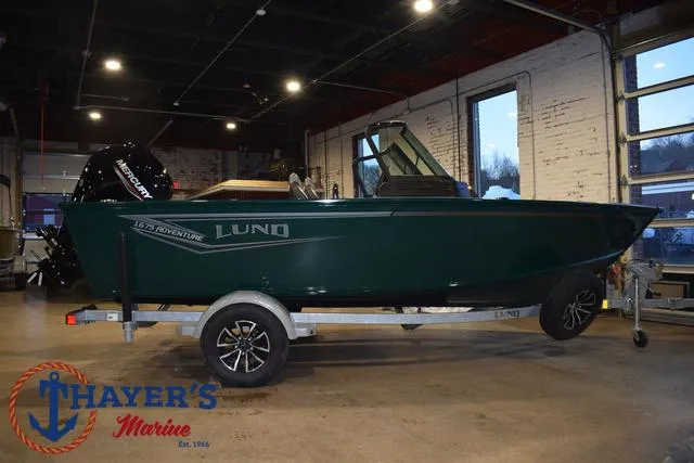 Slide: The Image of 2025 Lund 1675 Adventure Sport boat on trailer in showroom. - 45