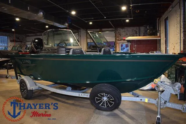 Slide: The Image of 2025 Lund 1675 Adventure Sport boat on trailer at Thayer's Marine showroom. - 46