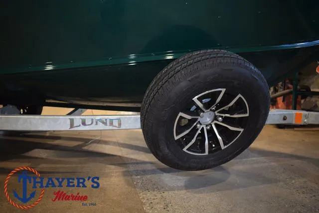 Slide: The Image of 2025 Lund 1675 Adventure Sport boat trailer with Thayer's Marine logo. - 6