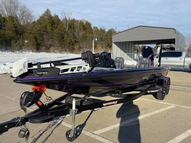Slide: The Image of 2025 Phoenix 721zxl bass boat on trailer in sunny parking lot. - 11