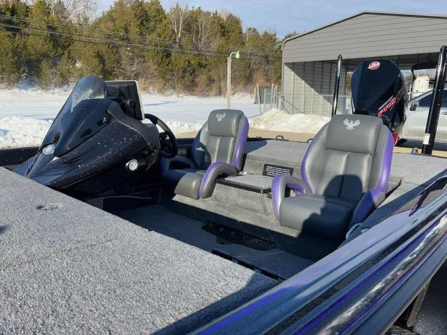 Slide: The Image of 2025 Phoenix 721zxl boat with dual seats and sleek design in a snowy setting. - 12