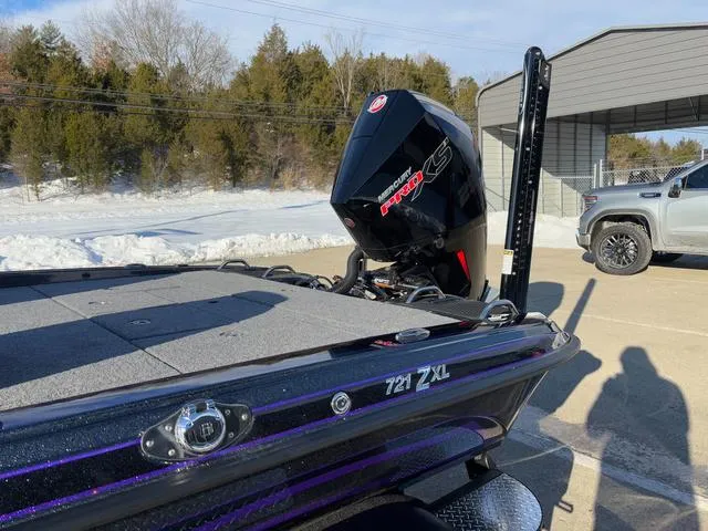 Slide: The Image of 2025 Phoenix 721zxl boat with powerful engine, parked outdoors in sunny weather. - 14
