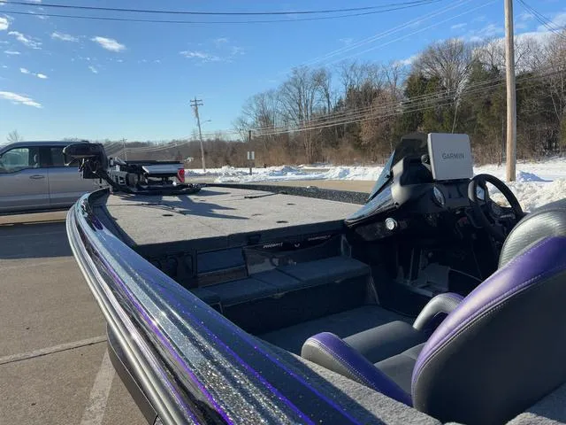 Slide: The Image of 2025 Phoenix 721zxl bass boat with Garmin system, parked in snowy lot. - 15