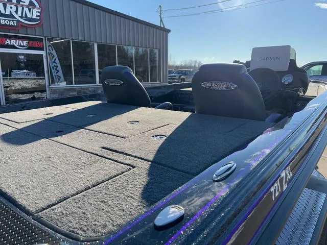 Slide: The Image of 2025 Phoenix 721zxl boat with Garmin system, parked outside a marine shop. - 4