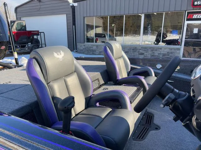 Slide: The Image of 2025 Phoenix 721zxl boat interior with dual seats and steering wheel. - 5