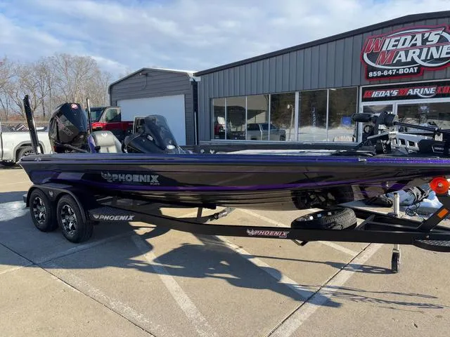 Slide: The Image of 2025 Phoenix 721zxl boat parked outside Wieda's Marine dealership. - 7