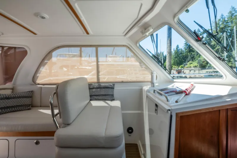 Slide: The Image of Interior of 2016 Back Cove 30 boat with comfortable seating and large windows. - 18
