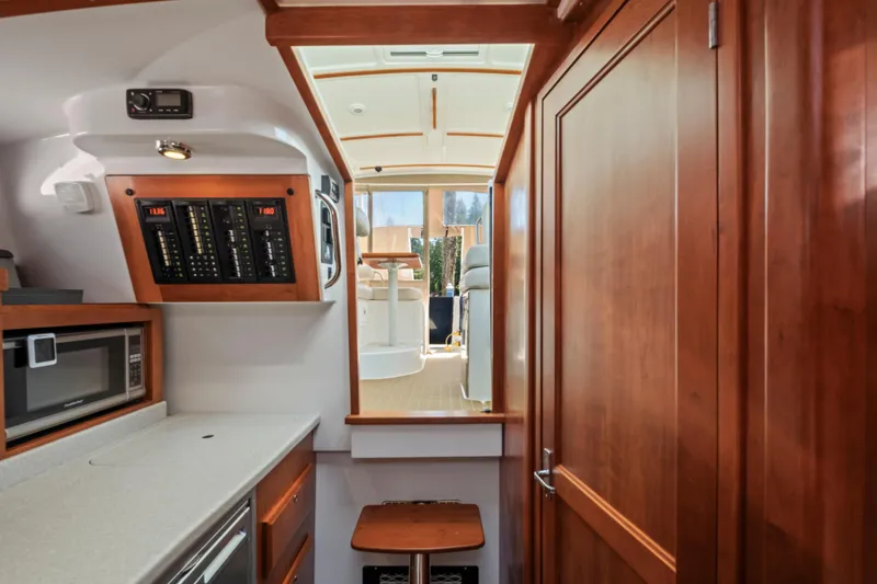 Slide: The Image of Interior of 2016 Back Cove 30 yacht with kitchenette and control panel. - 20
