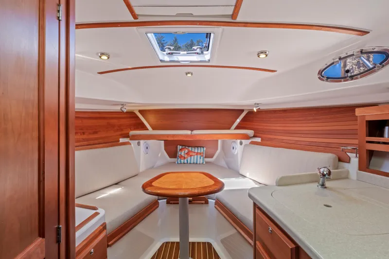 Slide: The Image of Luxurious 2016 Back Cove 30 yacht interior with wood accents and skylight. - 25