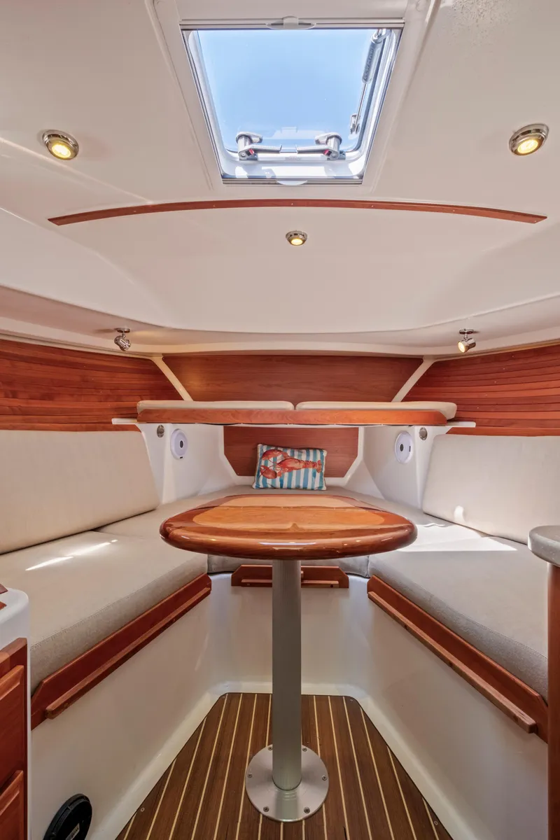 Slide: The Image of 2016 Back Cove 30 interior with wood accents and skylight. - 27