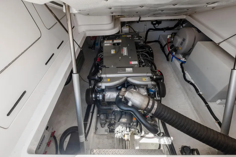Slide: The Image of Engine compartment of 2016 Back Cove 30 boat, showcasing detailed mechanical components. - 33