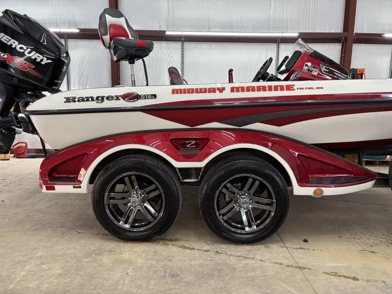 Slide: The Image of 2018 Ranger Z518c boat with Mercury engine and custom trailer in a garage. - 12
