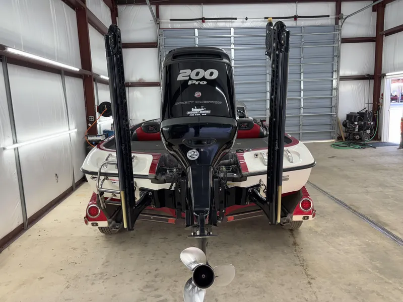 Slide: The Image of 2018 Ranger Z518c boat with 200 Pro motor in a garage. - 14
