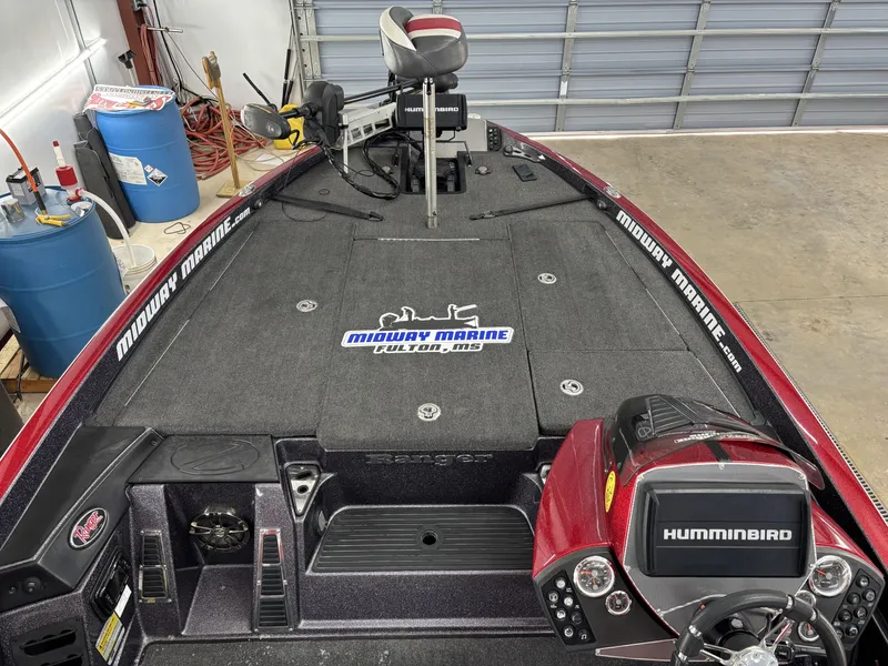 Slide: The Image of 2018 Ranger Z518c fishing boat interior with Humminbird electronics and Midway Marine branding. - 16