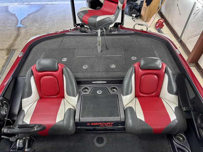 Slide: The Image of 2018 Ranger Z518c boat interior with red and gray seats, Mercury Pro Team branding. - 19