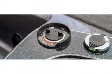 Slide: The Image of 2018 Ranger Z518c oil cap and fuel cap on boat dashboard. - 25