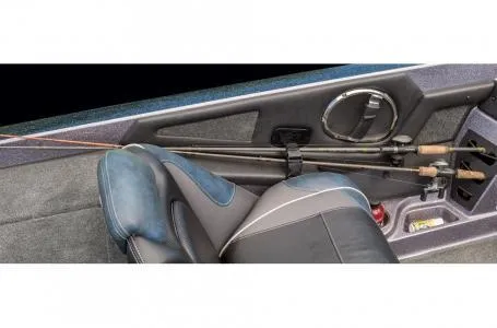 Slide: The Image of 2018 Ranger Z518c boat interior with fishing rods secured on the seat. - 26