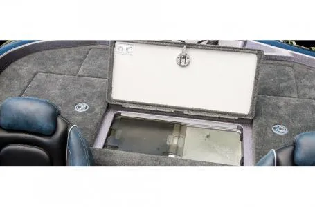 Slide: The Image of 2018 Ranger Z518c boat interior with open storage compartment and seating. - 28