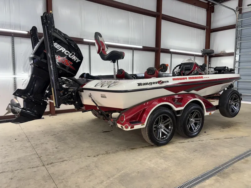 Slide: The Image of 2018 Ranger Z518c boat with Mercury engine in a garage setting. - 33