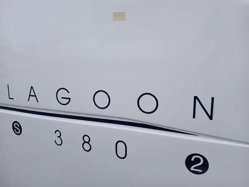 Slide: The Image of Lagoon 380 S2 catamaran, 2007 model, white hull with black lettering. - 13