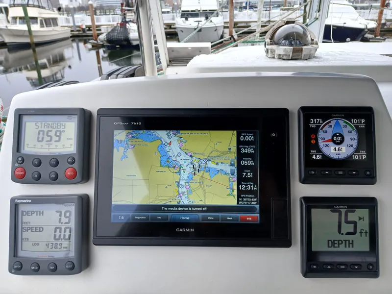 Slide: The Image of Navigation instruments on a 2007 Lagoon 380 S2 catamaran, featuring GPS and depth displays. - 17