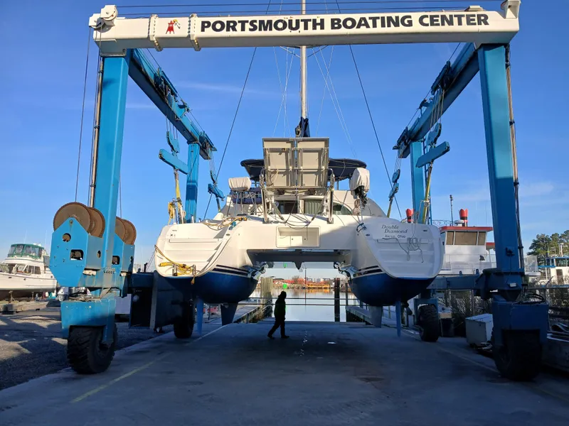 Slide: The Image of Lagoon 380 S2 catamaran from 2007 at Portsmouth Boating Center lift. - 20