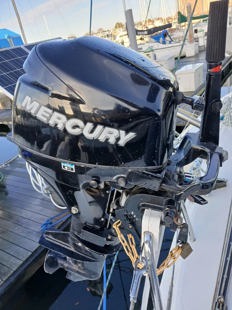 Slide: The Image of Mercury outboard motor on a 2007 Lagoon 380 S2 catamaran at a marina. - 21